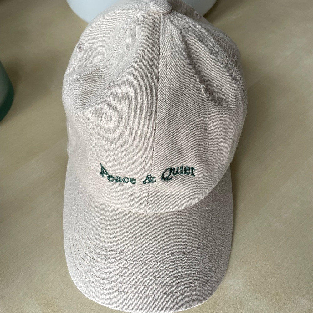 Museum of Peace and Quiet “Peace & Quiet” hat in Bone with Green lettering